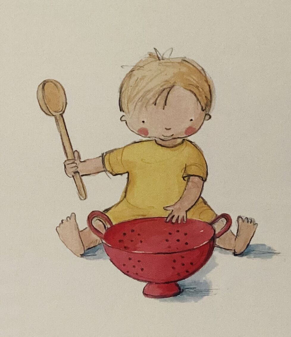 Illustration from Can We Lick the Spoon Now? — a smiling toddler in a yellow shirt sitting behind a red colander and holding up a wooden spoon